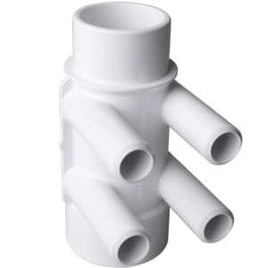 White plastic irrigation manifold with four angled outlets around a central vertical pipe